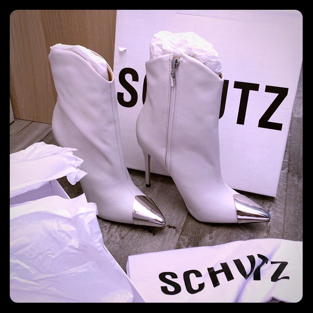 White Schutz boots with metal tip